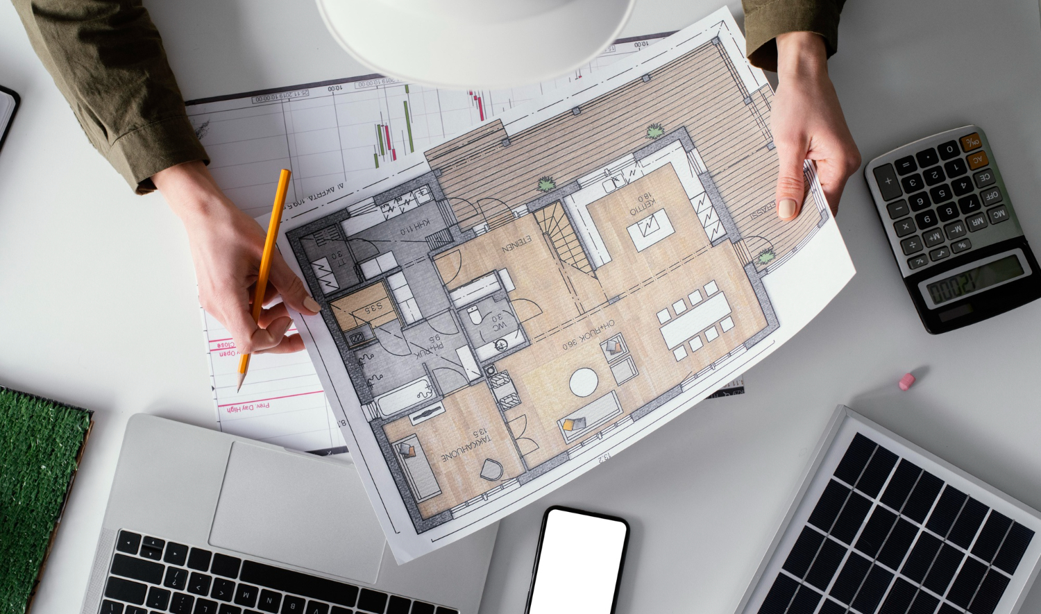 a construction plan in hands of architect